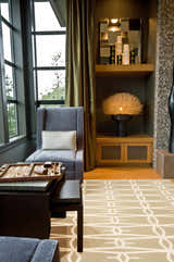 Contemporary mudroom with tan Lambourn Area Rug, gray chair, backgammon table, and warm lighting. Roomscene-Rectangle
