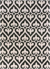 Close-up of the Landa Area Rug: a hand-tufted, rectangular rug with a black and cream geometric, heart-like pattern. Design-Rectangle-811