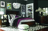 Contemporary bedroom with dark walls and Landa Area Rug, a black and cream rug with a bold pattern. Roomscene-Rectangle