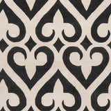 Close-up of the Landa Area Rug showing its black and cream, heart-like geometric pattern. Swatch