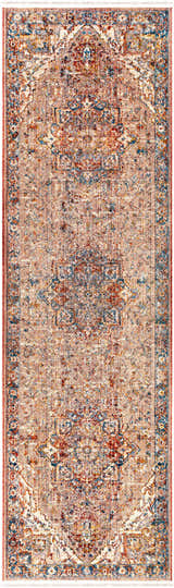 Close-up of the Lappe Area Rug. Bohemian style rug with cream, blue, peach, and rust colors and a traditional pattern. Design-Runner-279