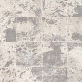 Close-up of the Lares Area Rug. Charcoal, light beige, medium gray, and tan hues create an abstract, contemporary pattern. Swatch