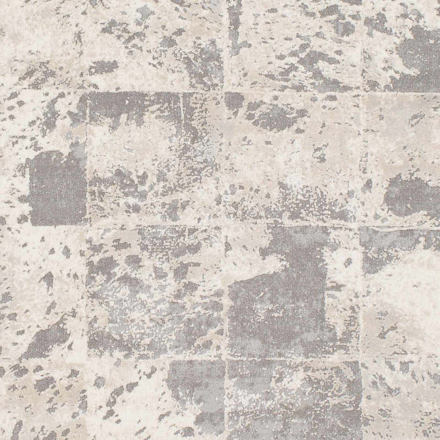 Close-up of the Lares Area Rug. Charcoal, light beige, medium gray, and tan hues create an abstract, contemporary pattern. Swatch
