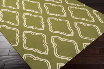Close-up of the Larimore Area Rug in olive and peach, featuring a hand-woven contemporary design. Corner