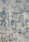 Close-up of the Larne Area Rug, featuring a distressed abstract pattern in dark blue, gray, beige, and white tones. Design-Rectangle-5373