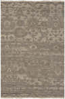 Close-up of the Lerwick Carpet, a hand-knotted wool rug with a traditional floral pattern in beige, charcoal, and brown tones. Design-Rectangle