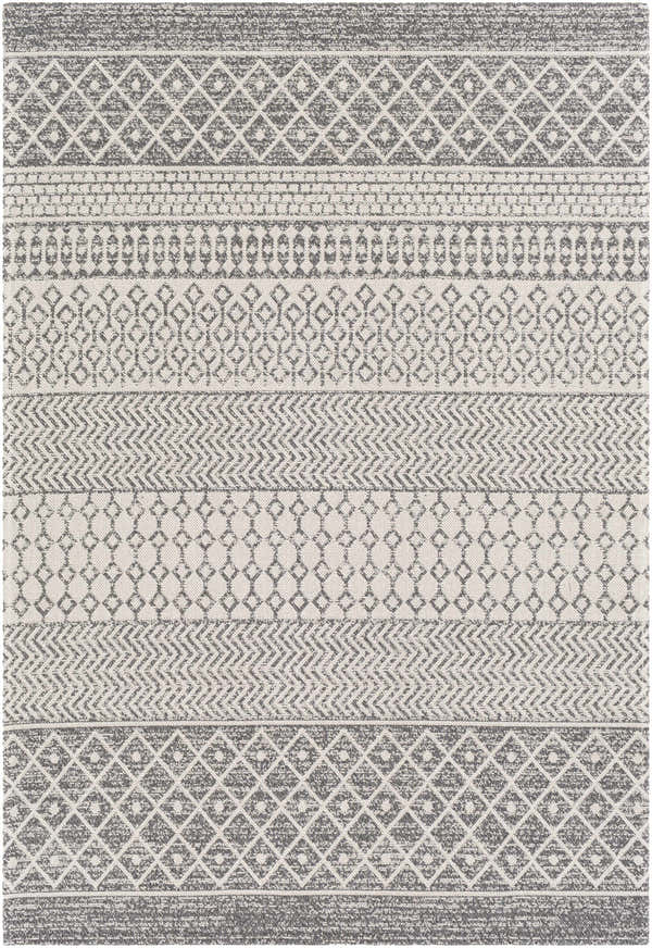 Close-up of the Lester Washable Area Rug, showcasing its gray, charcoal, and white bohemian-inspired geometric pattern. Design-Rectangle-5373