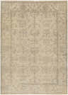 Close-up of the Lewes Clearance Rug. Hand-knotted wool rug in charcoal and taupe with a farmhouse floral and geometric pattern. Design-Rectangle