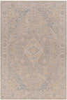 Close-up of the Leya Thick Luxe Area Rug featuring a traditional pattern in taupe, blue, and mustard tones. Design-Rectangle-6796