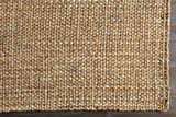 Close-up of the hand woven Leyton Natural Jute Rug showing texture and natural ivory and tan color variations. Corner