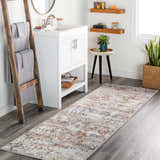 Bathroom scene with Loughrea Area Rug runner in brick red, cream, and denim colors. Rustic ladder and white vanity. Roomscene-Runner