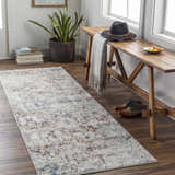 Entryway scene with a cream, brick red, and denim Loughrea Area Rug runner, wood bench, and plant. Roomscene-Runner