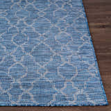 Close-up of the blue Lidlington Flatweave Area Carpet showing its geometric pattern and flatweave texture on a wood floor. Front