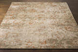Close-up of the Limay Premium Wool Rug. Bohemian style rug with brick red, beige, and olive floral pattern. Front