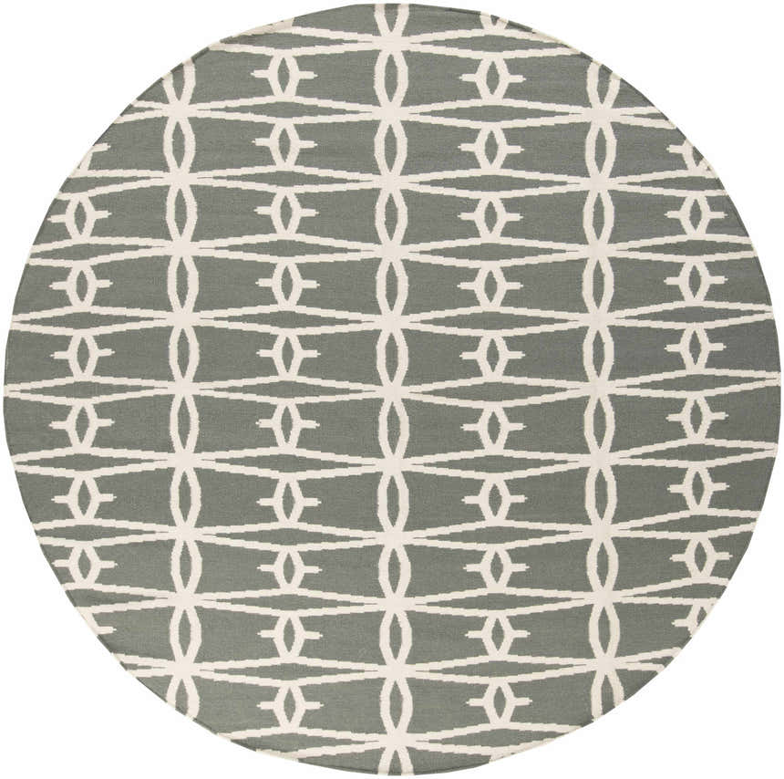 Close-up of round Lipan Area Rug. Hand woven wool rug in charcoal and peach with a contemporary geometric pattern. Design-Round-8