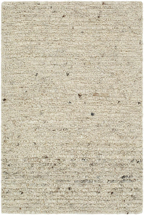 Close-up of the hand-tufted Winta Wool Area Rug. Ash, beige, and tan wool fibers create a nubby, textured farmhouse design. Design-Rectangle-23