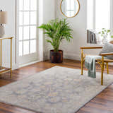 Living room with Coby Brown Avant Garde rug, wood floors, gold accents, and natural light. Farmhouse style. Roomscene-Rectangle