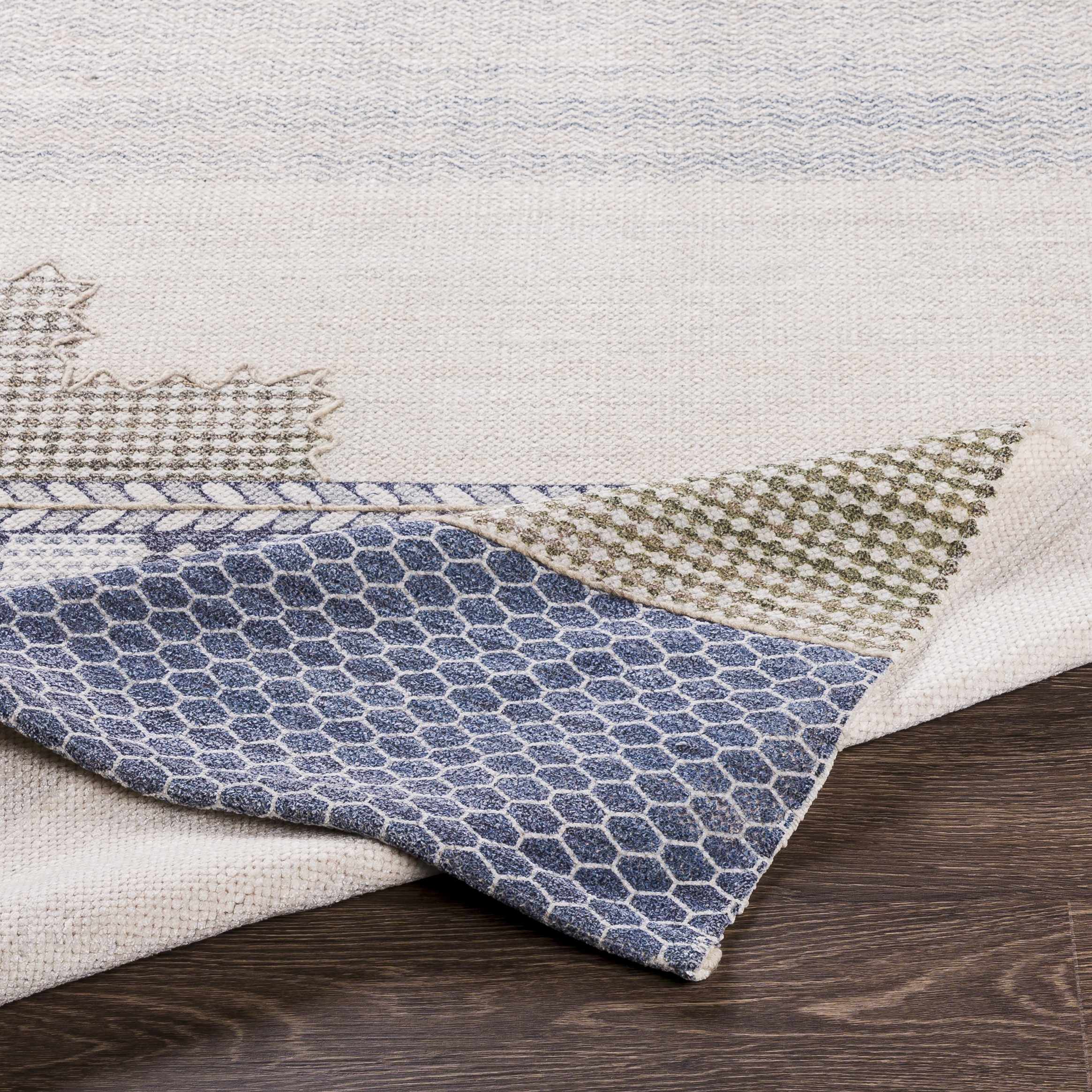 Folded section of Llansteffan Carpet - Clearance, displaying material thickness and weave. Transitional,Bohemian Area Rug Backing  