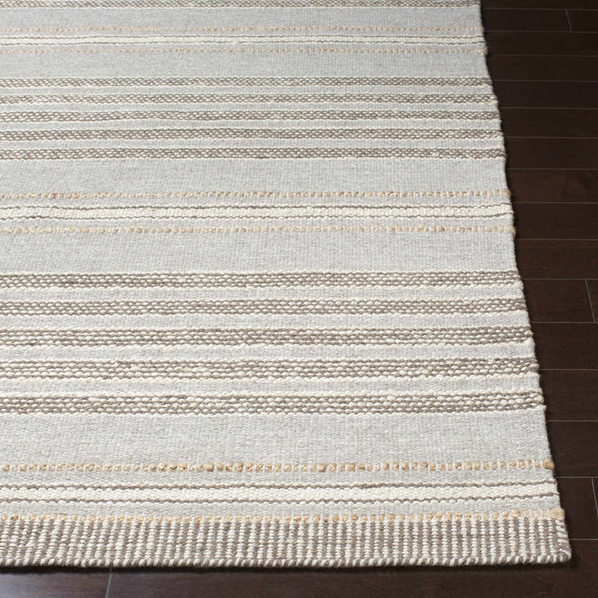 Close-up of the hand woven Allendorf Area Rug. Beige, charcoal, cream, and gray stripes. Wool rug texture. Front