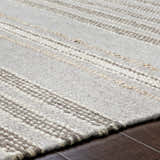Close-up of the hand woven Allendorf Area Rug. Beige, cream, and charcoal stripes add texture to this wool rug. Texture