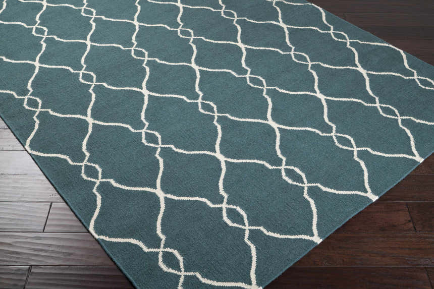 Close-up of the Allenspark Area Rug showing its light beige trellis pattern on a medium gray wool texture. Corner