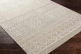 Close-up of the Lone Beige Tufted Maroc Wool Rug showing its geometric, Moroccan-inspired pattern and soft, textured wool. Corner