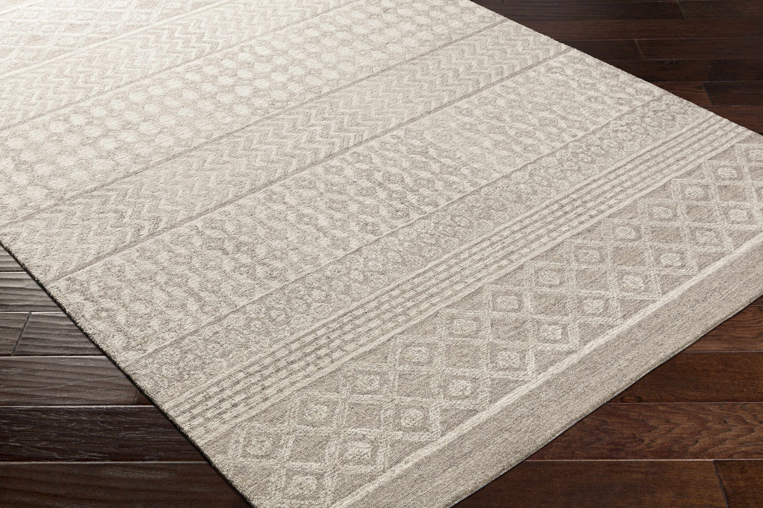Close-up of the Lone Beige Tufted Maroc Wool Rug showing its geometric, Moroccan-inspired pattern and soft, textured wool. Corner