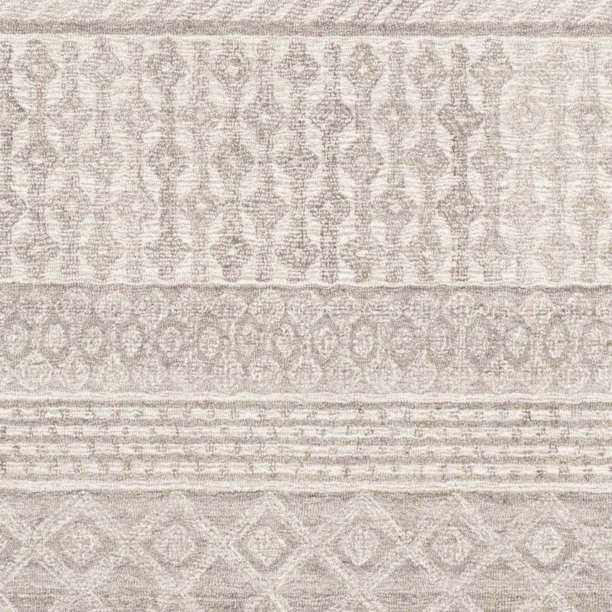 Close-up of the Lone Beige Tufted Maroc Wool Rug featuring a geometric Moroccan-inspired pattern and textured wool. Swatch