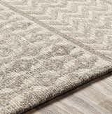 Close-up of the hand-tufted Lone Beige Tufted Maroc Wool Rug showing its texture and subtle Moroccan-inspired geometric pattern. Texture