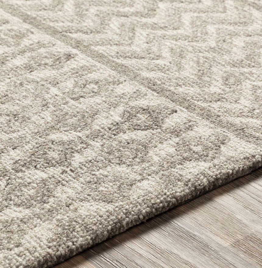 Close-up of the hand-tufted Lone Beige Tufted Maroc Wool Rug showing its texture and subtle Moroccan-inspired geometric pattern. Texture