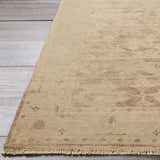 Close-up of the tan Lochmaben Premium Wool Rug showing its traditional pattern and hand-knotted texture. Front