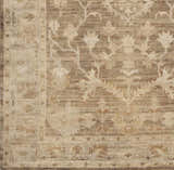 Close up of the Lochmaben Premium Wool Rug showing its traditional floral pattern in shades of tan, light brown, and ivory. Swatch