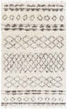 Close-up of the hand-woven Lochwinnoch Area Rug. Beige wool rug with dark brown and gray Moroccan-inspired shag pattern and fringe. Design-Rectangle-576