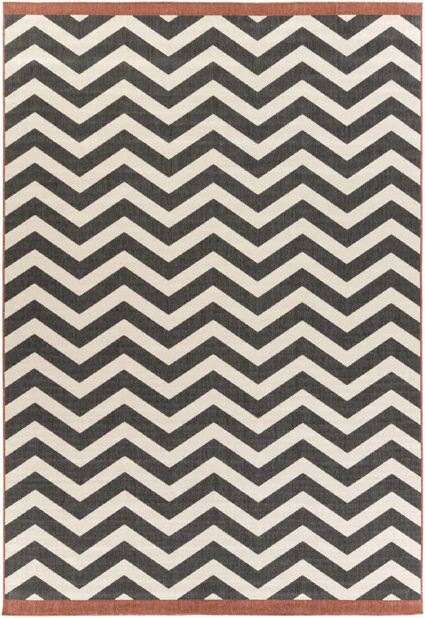 Close-up of the Lockhart Outdoor Rug. Black and light beige chevron pattern with a brick red border. Design-Rectangle-76109