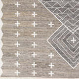 Close-up of Lodwar Area Rug, showing charcoal, cream, and gray geometric and cross pattern, hand woven texture. Swatch