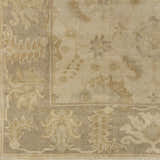 Close-up of the hand-knotted Longisland Clearance Rug. Features light beige and wheat tones with a traditional floral pattern. Swatch