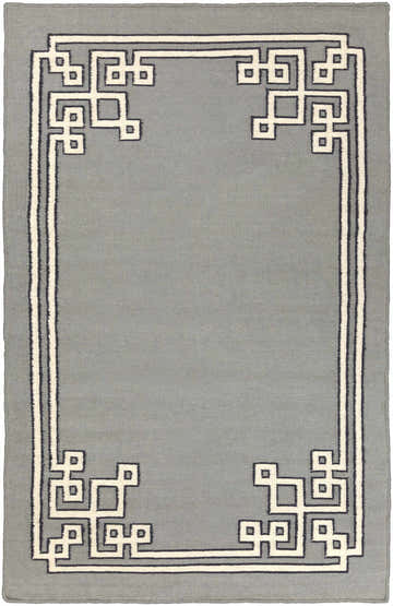 Close-up of the Lott Area Rug. Hand-woven wool rug in gray with geometric ink blue and light gray border pattern. Design-Rectangle