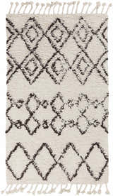Close-up of the Lothian Area Rug. Charcoal diamond pattern on ivory wool with tassels. Bohemian style. Design-Rectangle-576