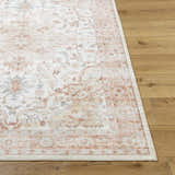 Close-up of the Lotan Pink Medallion Washable Area Rug, featuring a traditional light gray, tan, and sterling gray design. Front