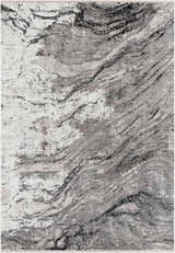 Close-up of the Littleport Luxury Fringed Faux Silk Rug in black, charcoal, gray, and light gray with a contemporary, abstract design. Design-Rectangle