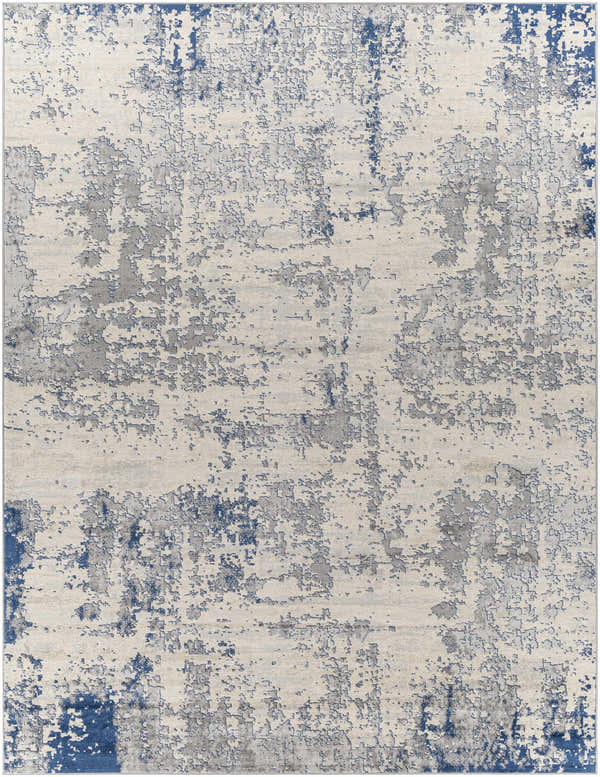 Close-up of the Lubao Area Rug, a contemporary rug in blue, charcoal, cream, and light gray with a distressed geometric pattern. Design-Rectangle-710103