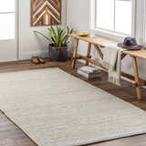 Entryway with Lumatil Area Rug in cream and beige. Farmhouse style with wood bench, plant, and wood art. Roomscene-Rectangle