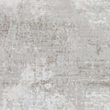 Close-up of the Lumbia Distressed Embossed Area Rug. Contemporary style rug with a textured pattern in shades of gray and beige. Swatch
