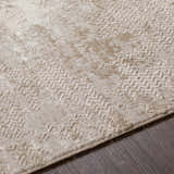 Close-up of the Lumbia Distressed Embossed Area Rug showing its beige color, subtle pattern, and textured weave. Texture