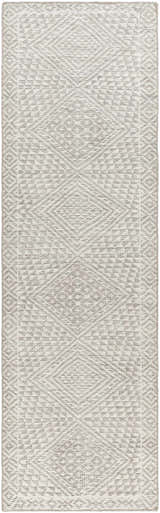 Close-up of the Lusacan Area Carpet. Hand-knotted rug in charcoal, gray, and off-white with a geometric, diamond pattern. Design-Runner-268