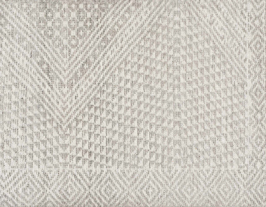 Close-up of the Lusacan Area Carpet; hand-knotted viscose rug in charcoal, gray, and off-white with a geometric pattern. Swatch
