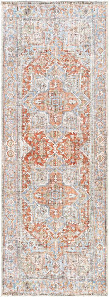 Close-up of the Rust Maayon Washable Rug, a traditional rug with brick red, blue, and sage green oriental-inspired patterns. Design-Runner-2773