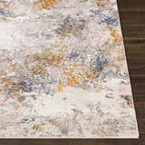 Close up of the Macayug Area Carpet showing its cream, blue, and rust abstract design and soft texture. Front