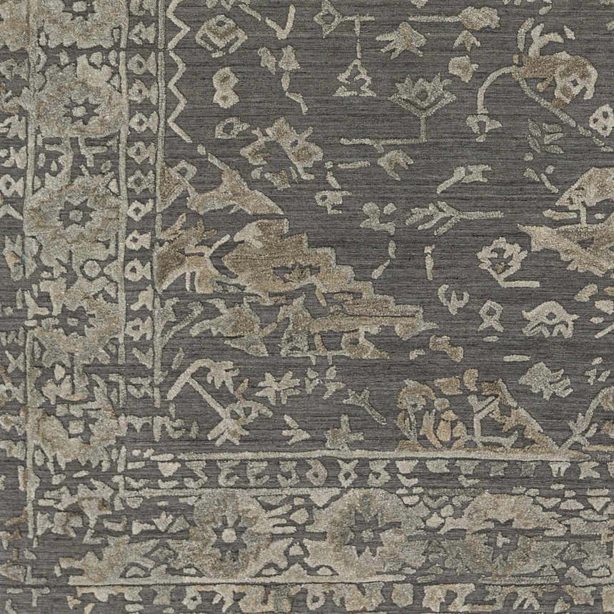 Close-up of the Macgregor Area Rug in charcoal, light gray, and olive. Bohemian style with traditional floral and geometric patterns. Swatch