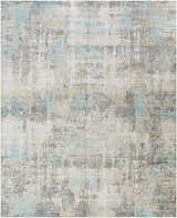Close-up of the Machen Area Rug, a contemporary design in beige, ice blue, and gray with a distressed pattern. Design-Rectangle-810